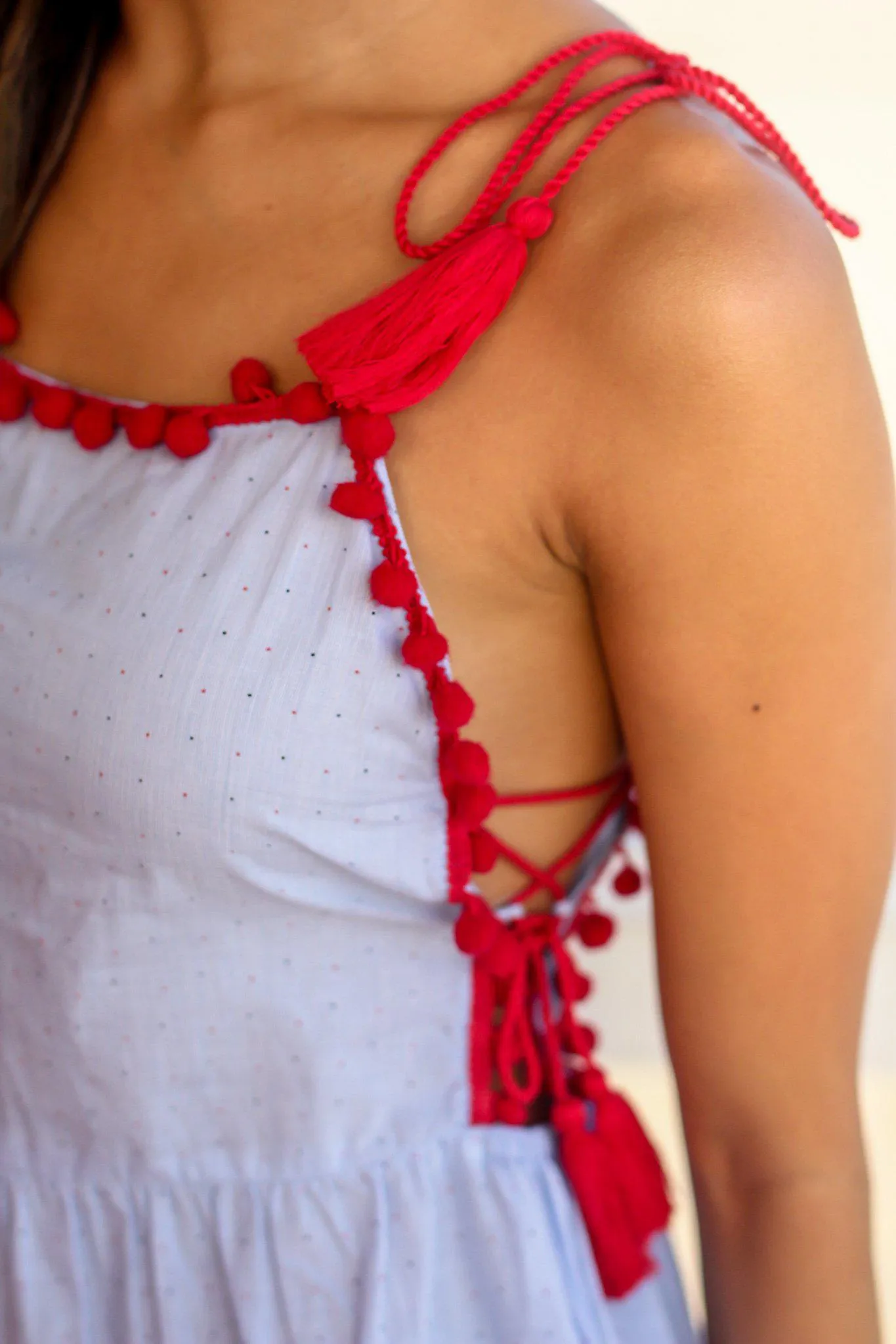 Light Blue Top with Tassel and Pom Pom Details